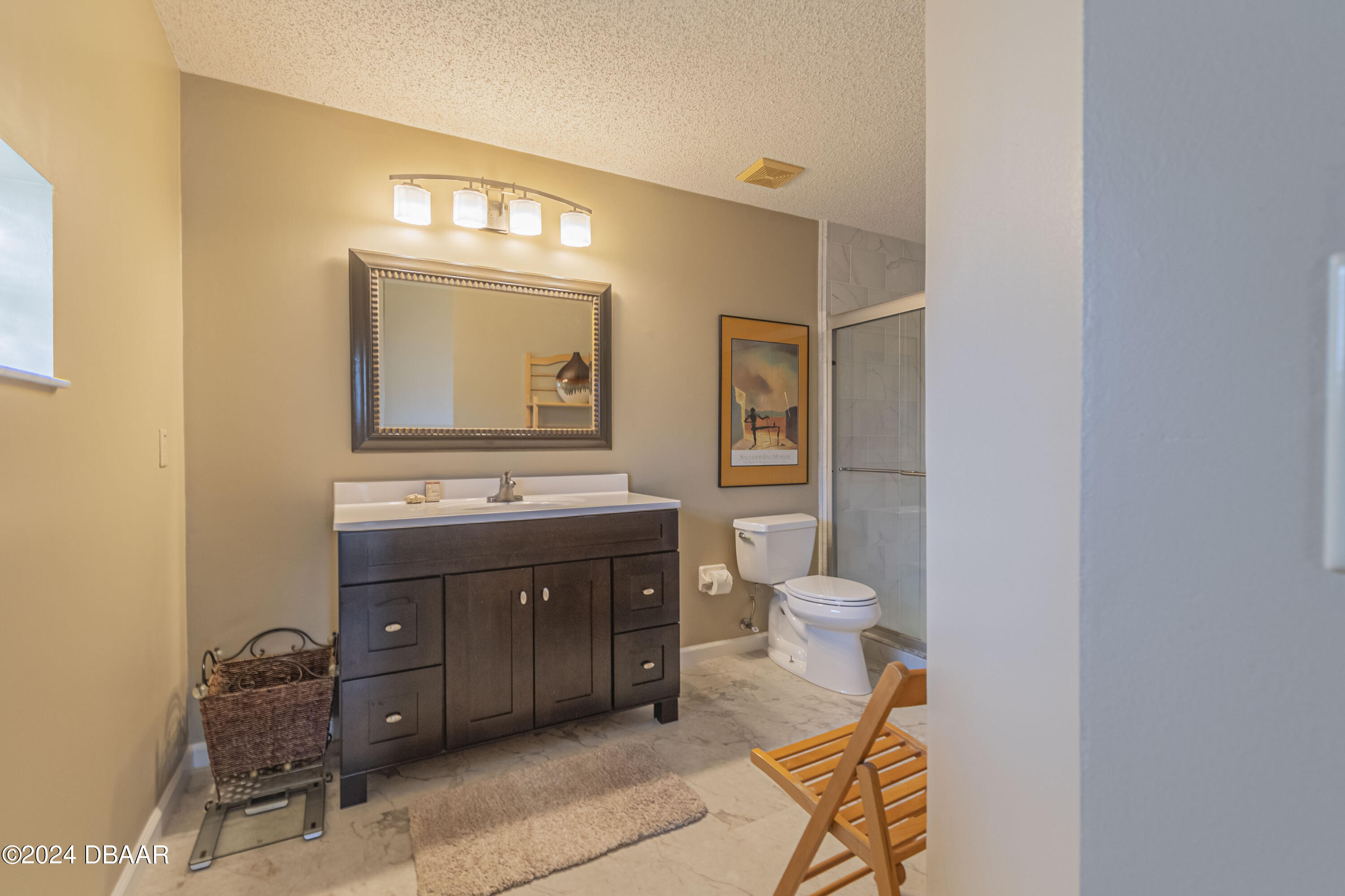 6236 Clover Bend Drive Port Orange, FL 32127 - Photo 42 of 73 a bathroom with a sink a toilet and a mirror