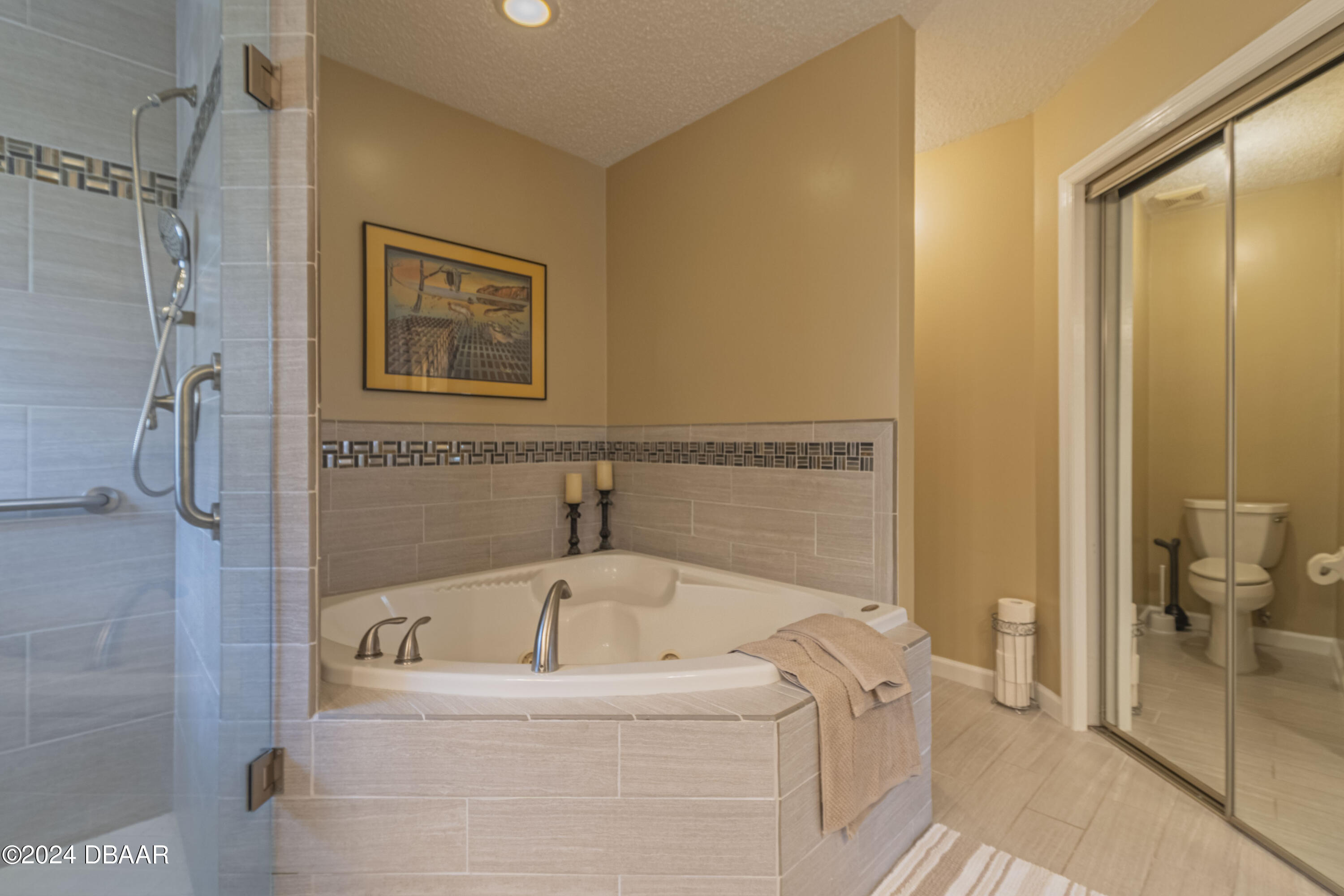 6236 Clover Bend Drive Port Orange, FL 32127 - Photo 46 of 73 a bathroom with a tub a mirror and a shower