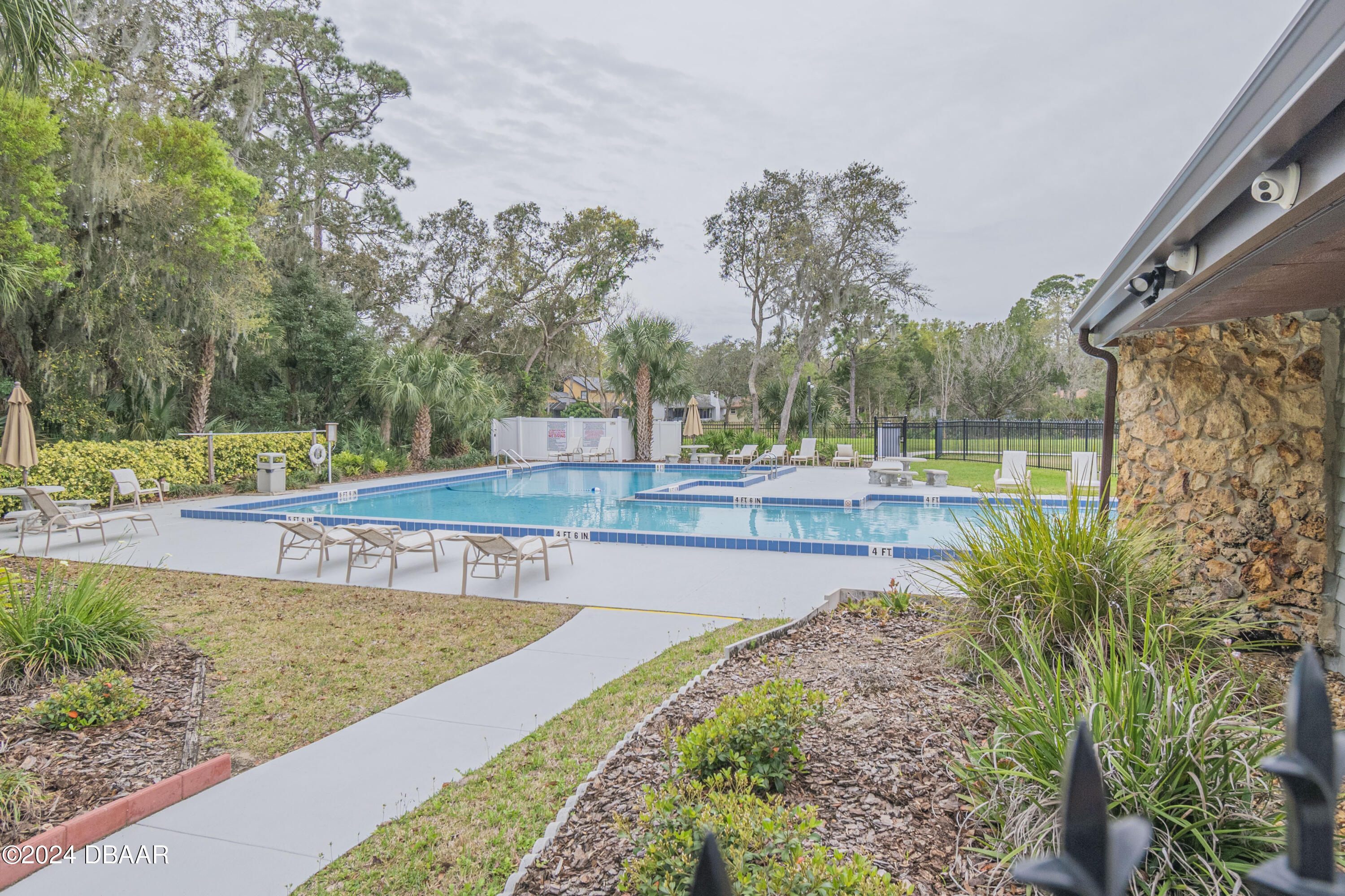 6236 Clover Bend Drive Port Orange, FL 32127 - Photo 67 of 73 a view of a swimming pool with a patio and a yard