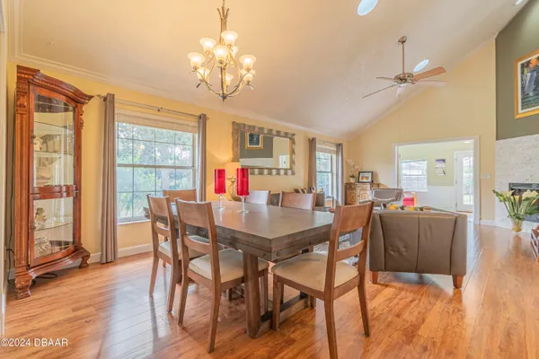 a kitchen with kitchen island granite countertop a sink cabinets and stainless steel appliances