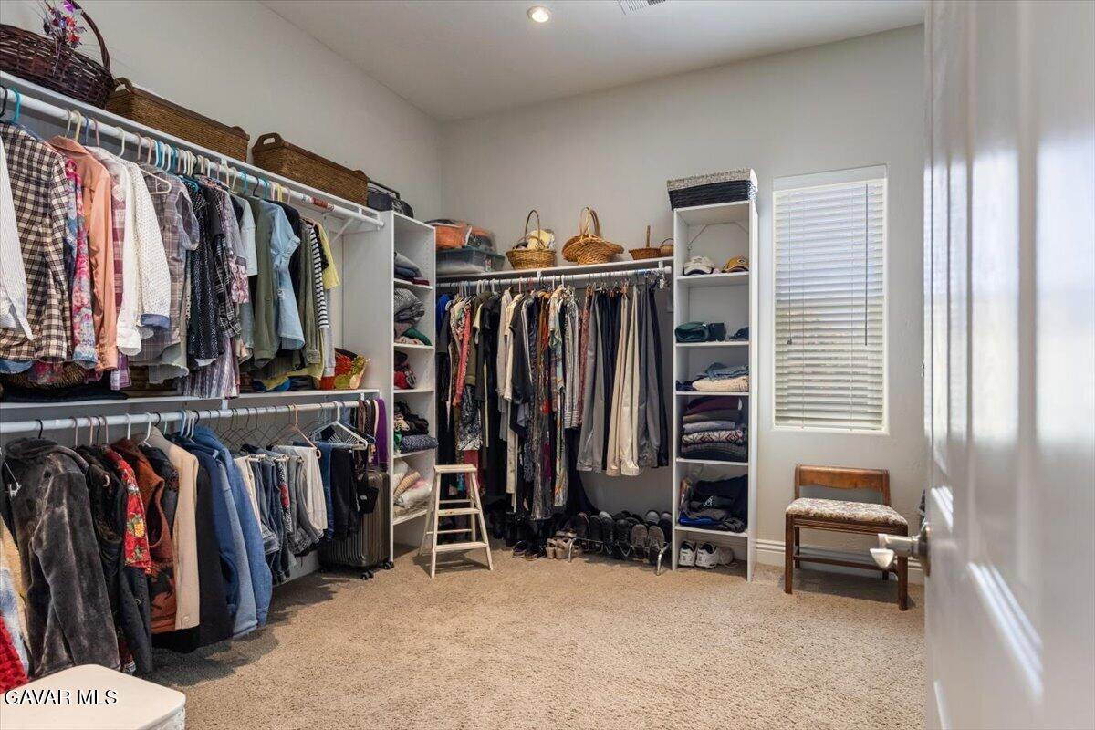 23840 Martingale Way Tehachapi, CA 93561 - Photo 33 of 63 a view of walk in closet with clothes and shoes