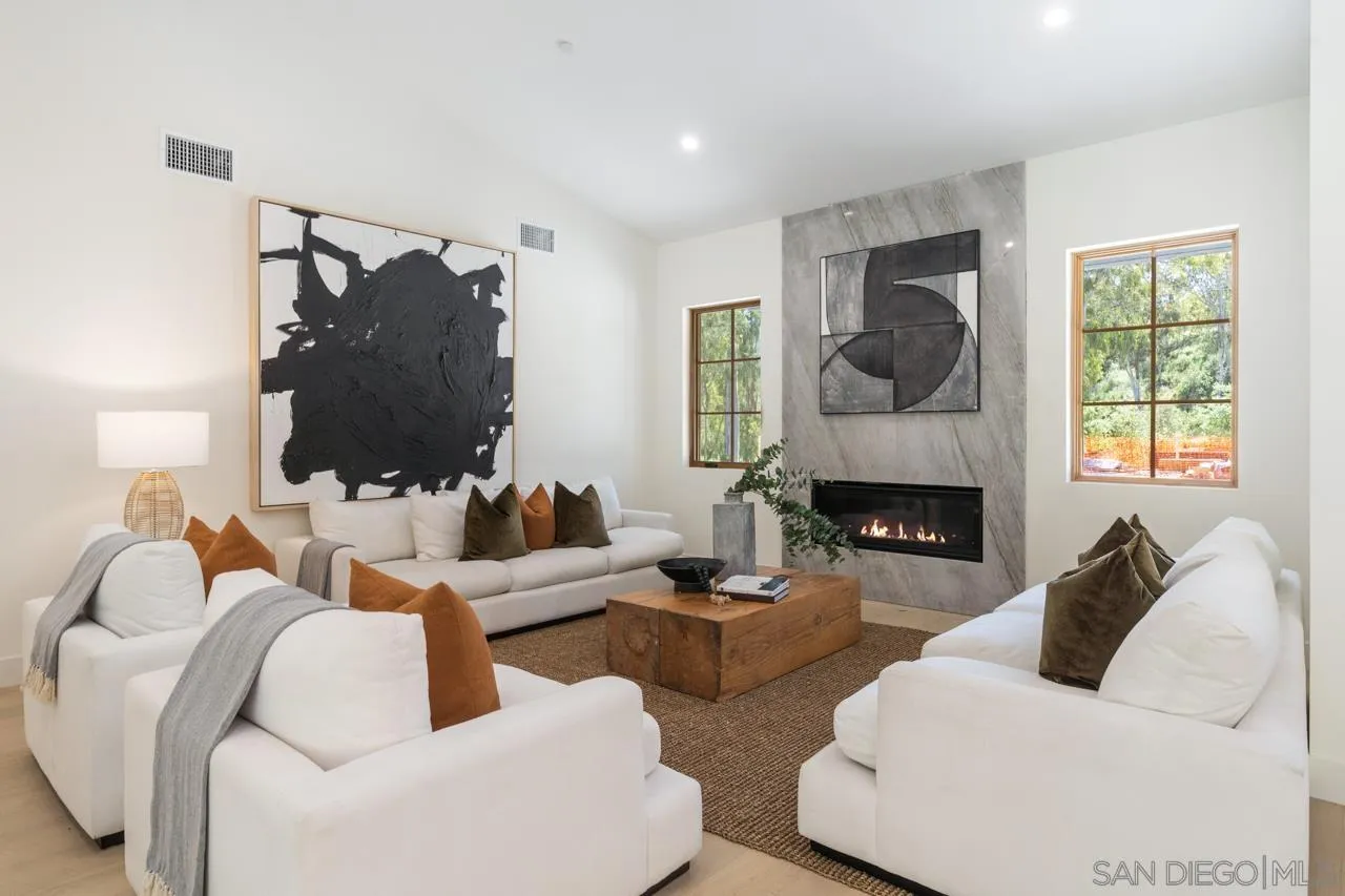 15245 El Camino Real Rancho Santa Fe, CA 92067 - Photo 12 of 41 a living room with furniture and a fireplace