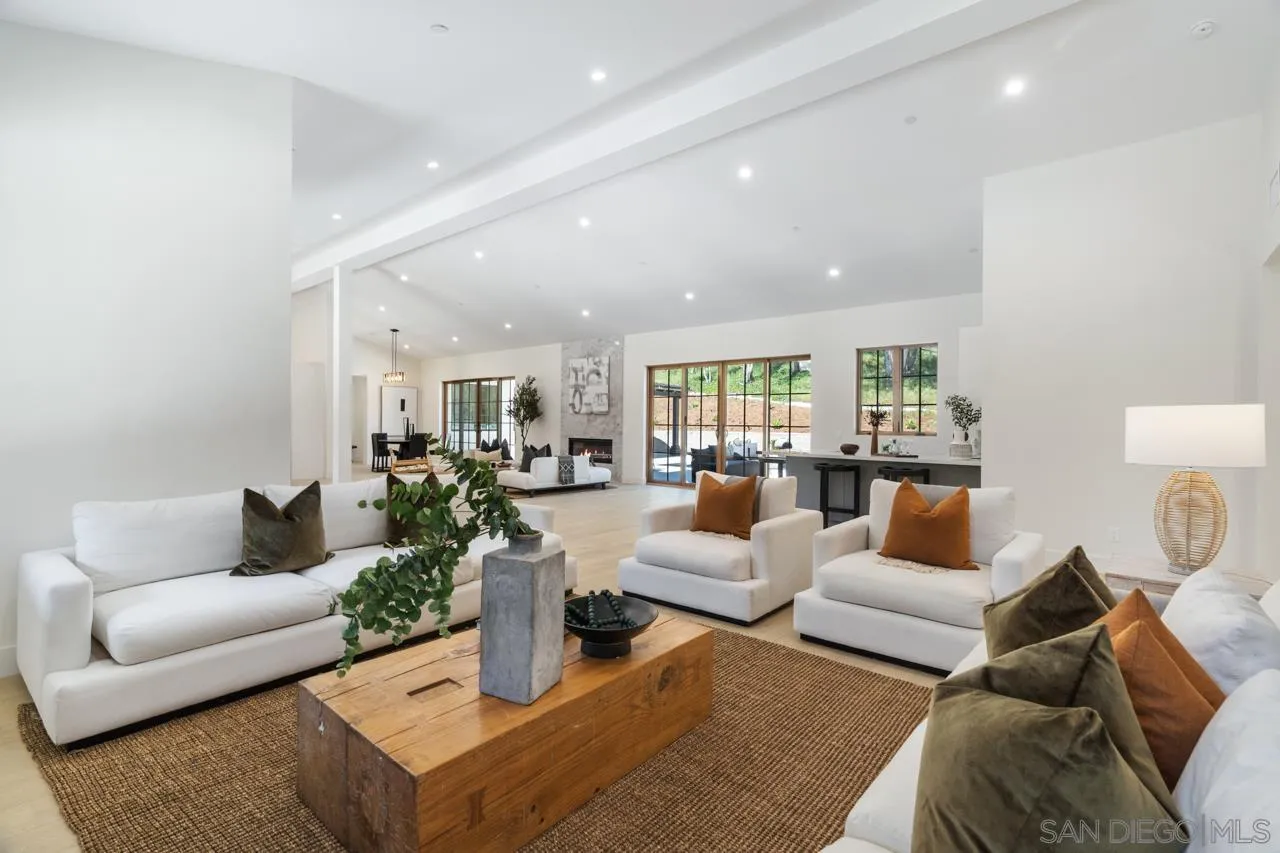15245 El Camino Real Rancho Santa Fe, CA 92067 - Photo 13 of 41 a living room with furniture and a large window