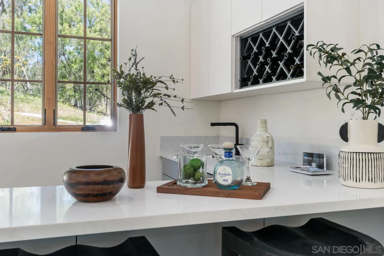 15245 El Camino Real Rancho Santa Fe, CA 92067 - Photo 15 of 41 a view of table and chair with potted plant