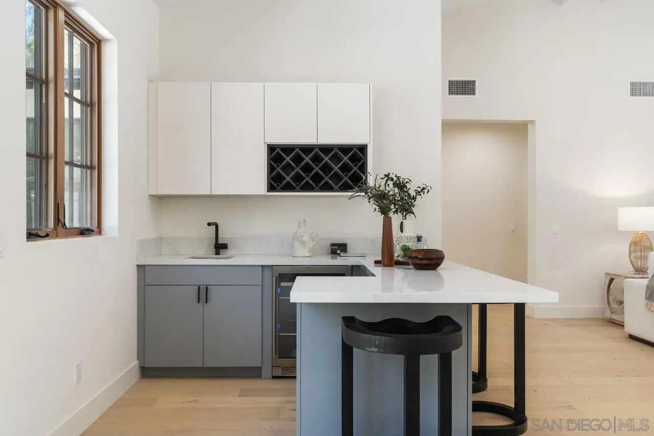15245 El Camino Real Rancho Santa Fe, CA 92067 - Photo 17 of 41 a kitchen with a sink cabinets and window
