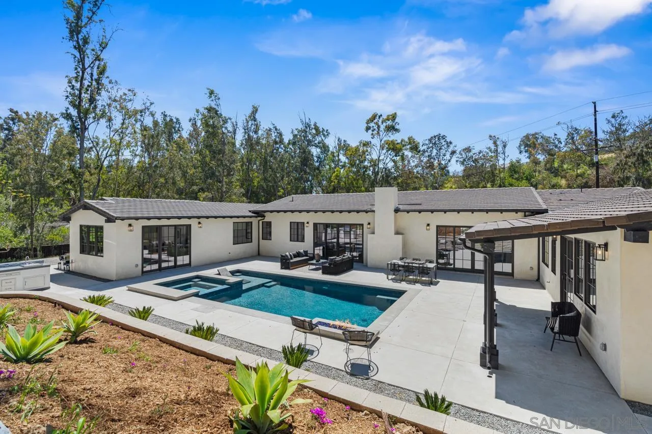 15245 El Camino Real Rancho Santa Fe, CA 92067 - Photo 2 of 41 an aerial view of a house with swimming pool garden and patio