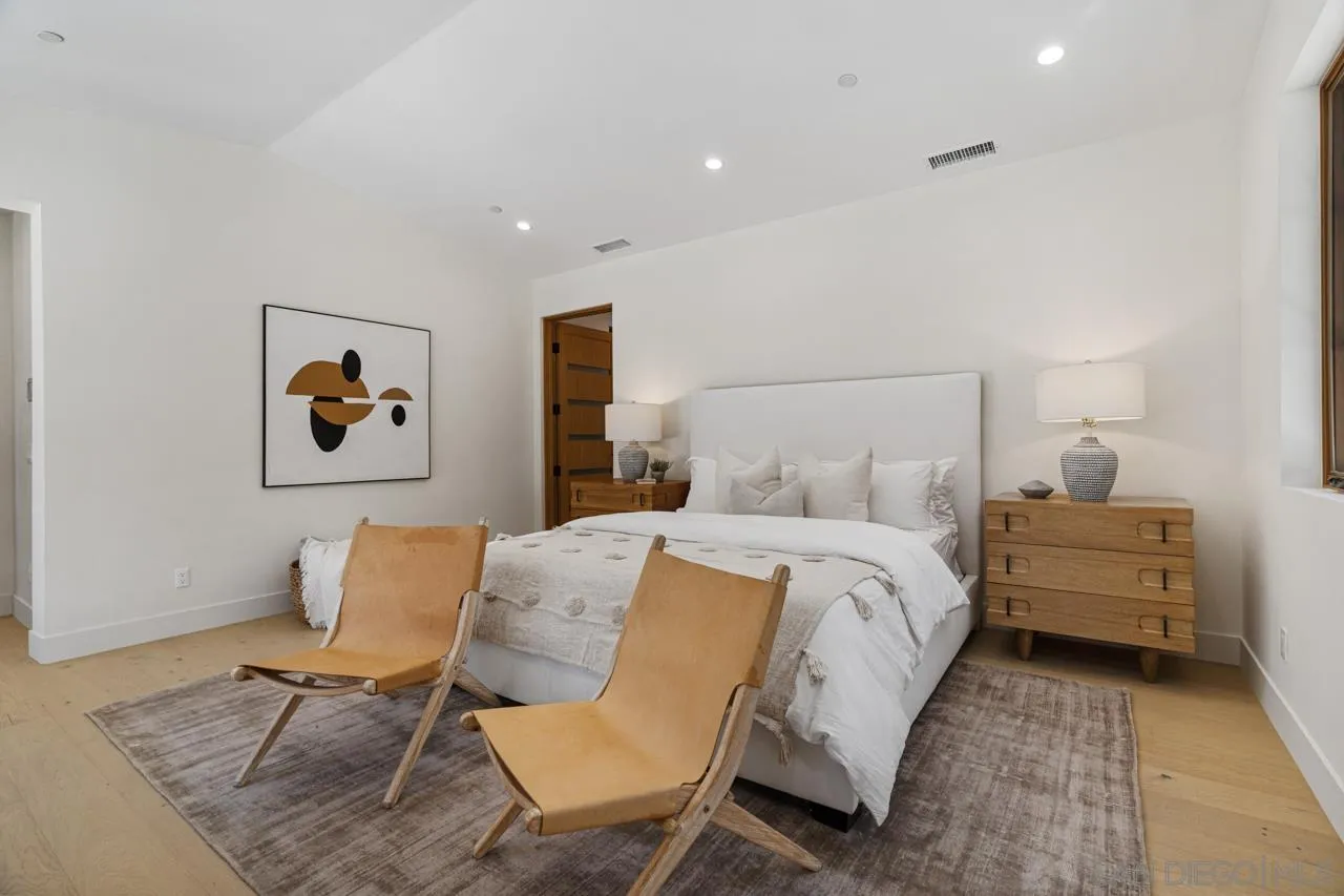 15245 El Camino Real Rancho Santa Fe, CA 92067 - Photo 23 of 41 a bedroom with a bed and chair
