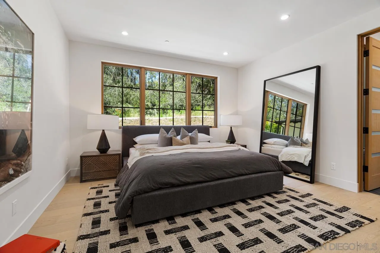 15245 El Camino Real Rancho Santa Fe, CA 92067 - Photo 28 of 41 a bedroom with a bed and a window