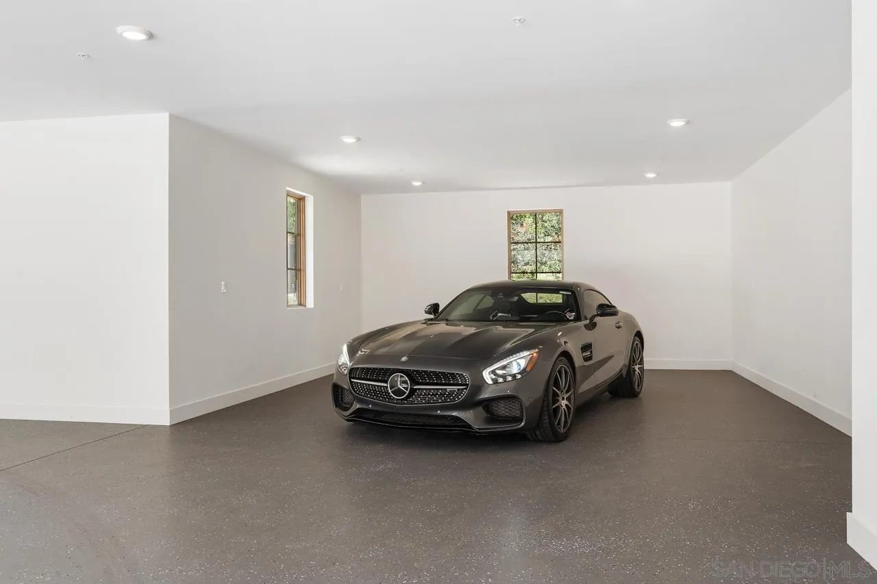 15245 El Camino Real Rancho Santa Fe, CA 92067 - Photo 40 of 41 a car parked in a room