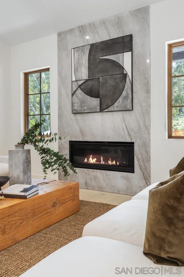 15245 El Camino Real Rancho Santa Fe, CA 92067 - Photo 4 of 41 a living room with furniture and a fireplace