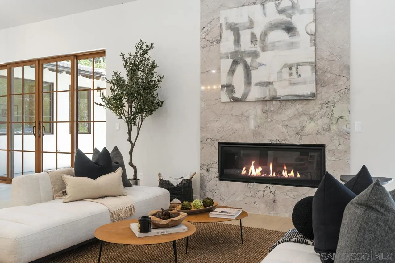 15245 El Camino Real Rancho Santa Fe, CA 92067 - Photo 7 of 41 a living room with furniture and a fireplace