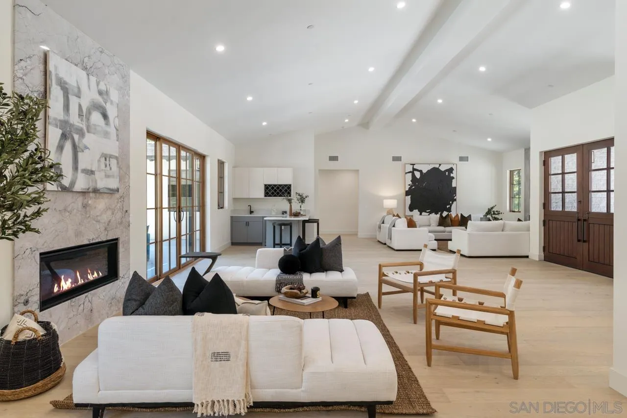 15245 El Camino Real Rancho Santa Fe, CA 92067 - Photo 9 of 41 a living room with furniture and fireplace