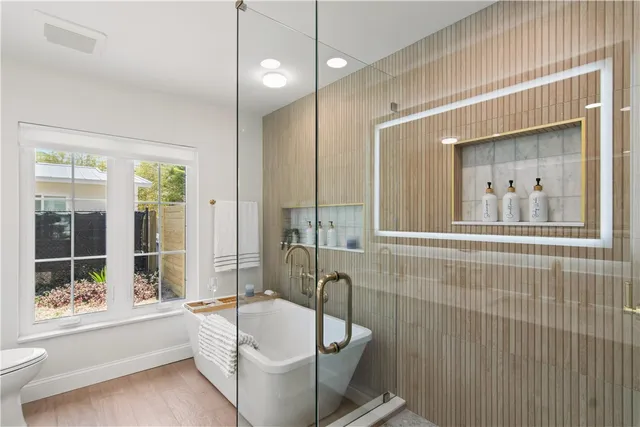 a bathroom with a bathtub and a sink