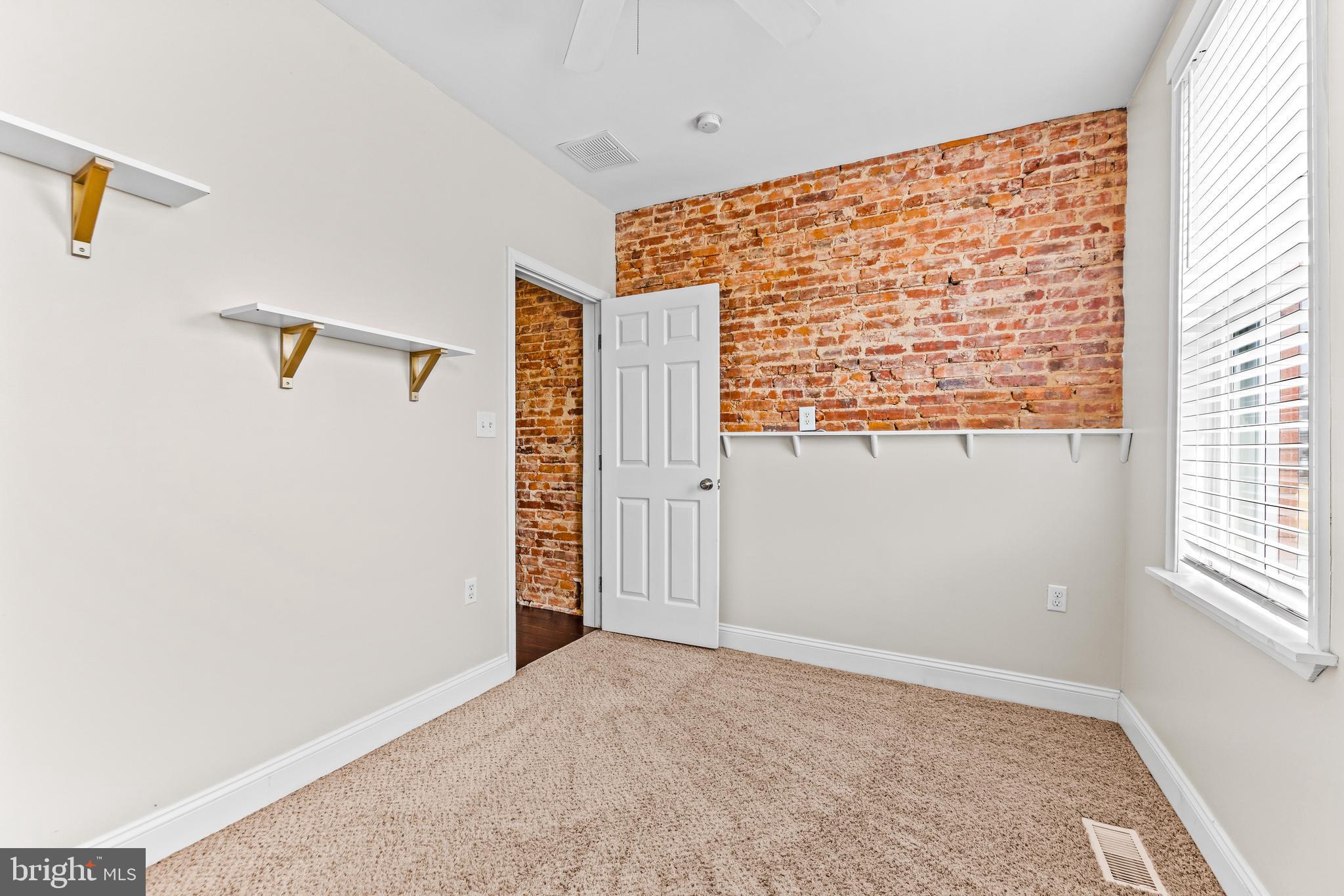 1243 Hull Street Baltimore, MD 21230 - Photo 22 of 39 a view of an empty room with a window