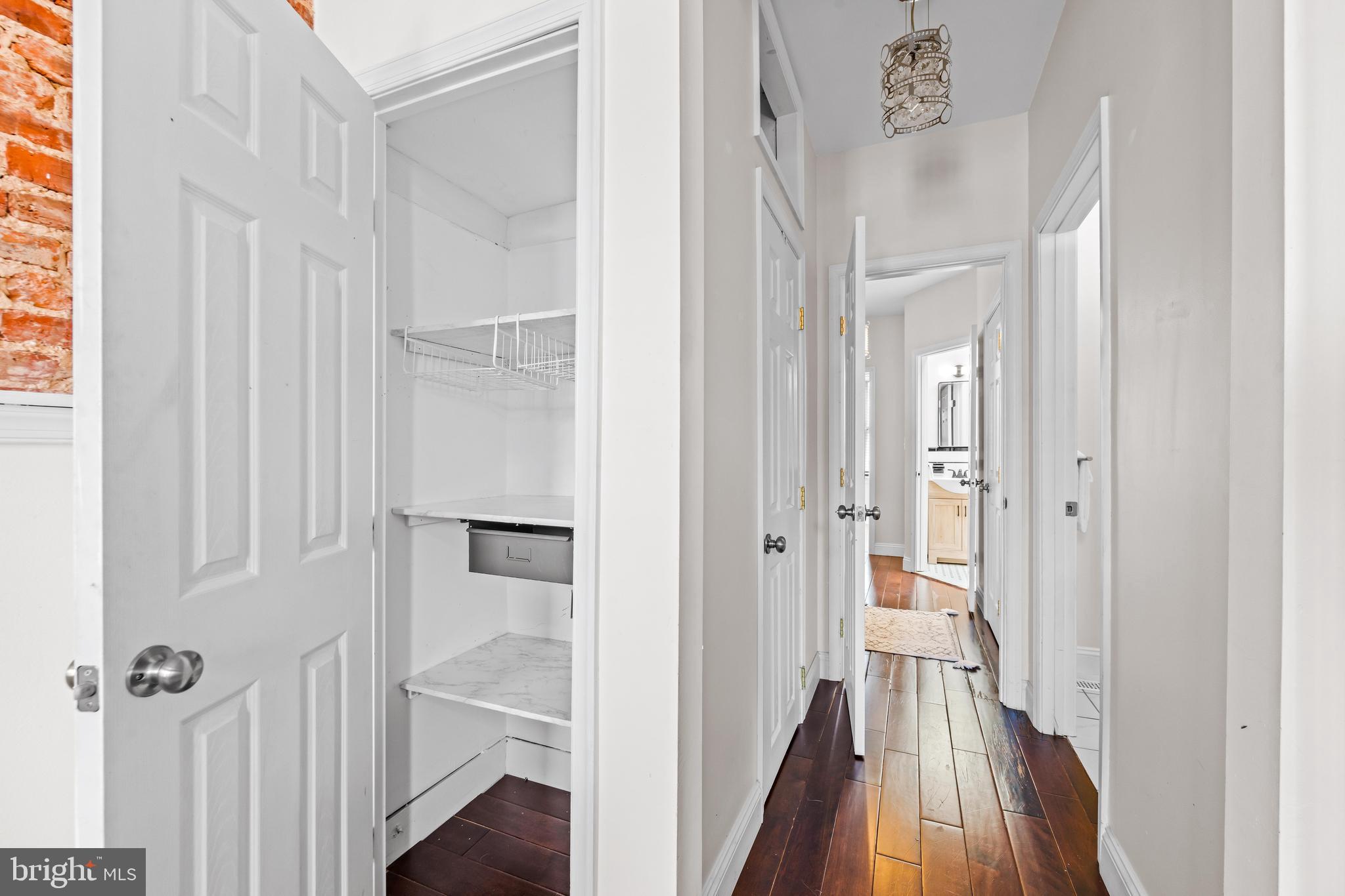 1243 Hull Street Baltimore, MD 21230 - Photo 27 of 39 a view of a hallway with wooden floor and staircase