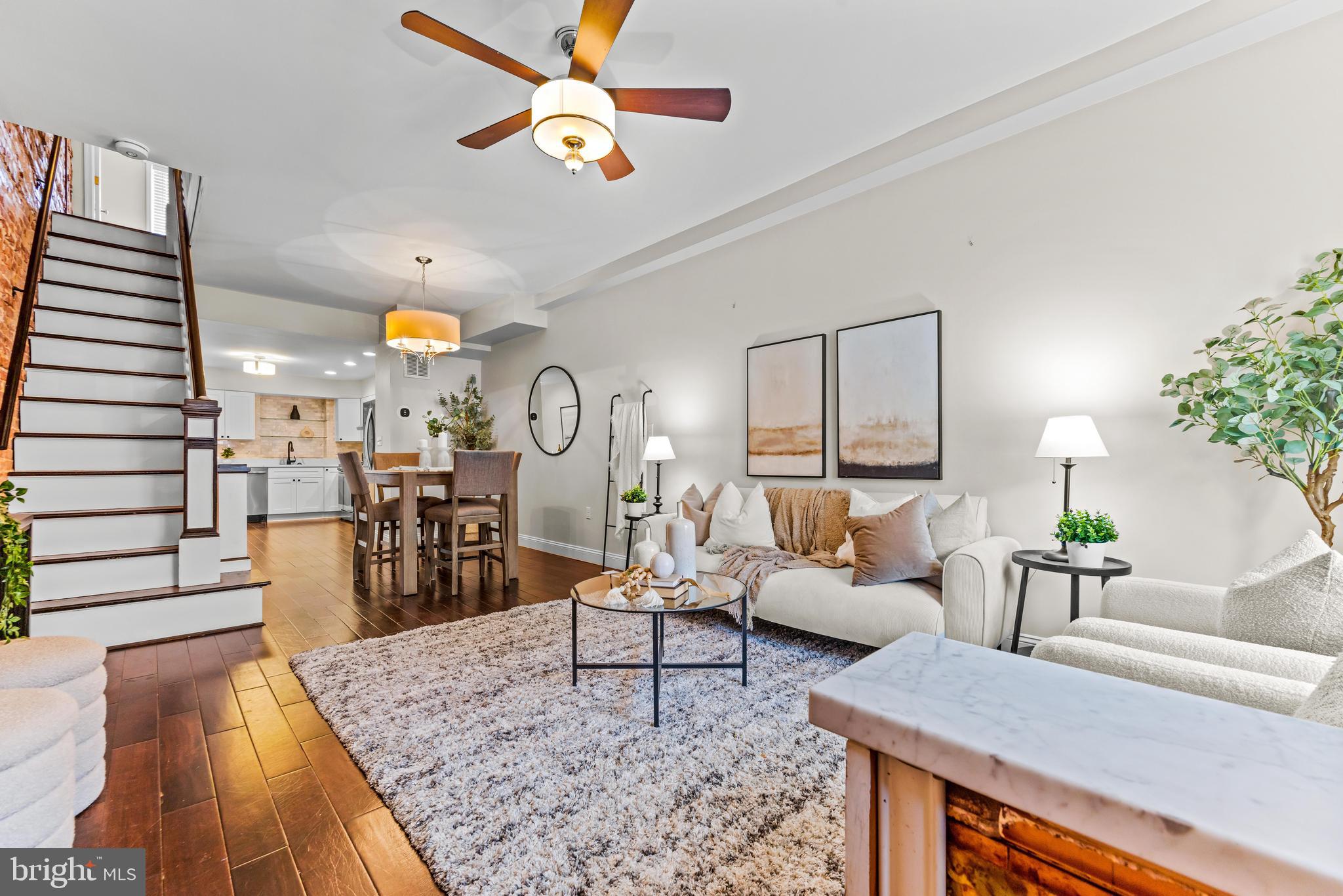1243 Hull Street Baltimore, MD 21230 - Photo 3 of 39 a living room with furniture and a wooden floor