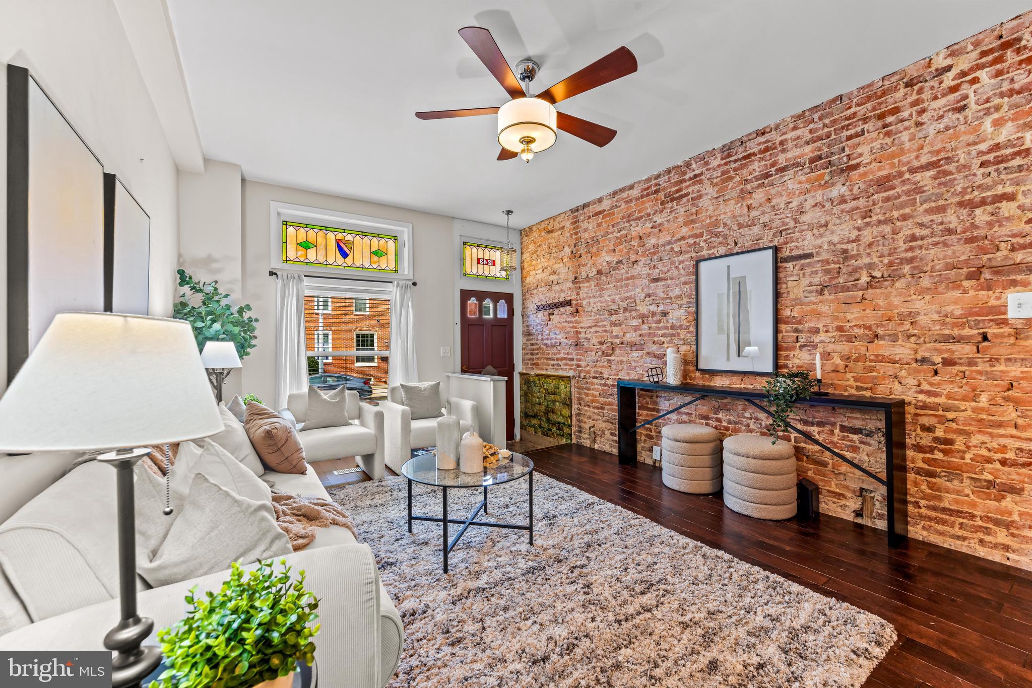 1243 Hull Street Baltimore, MD 21230 - Photo 6 of 39 a living room with furniture and a large window