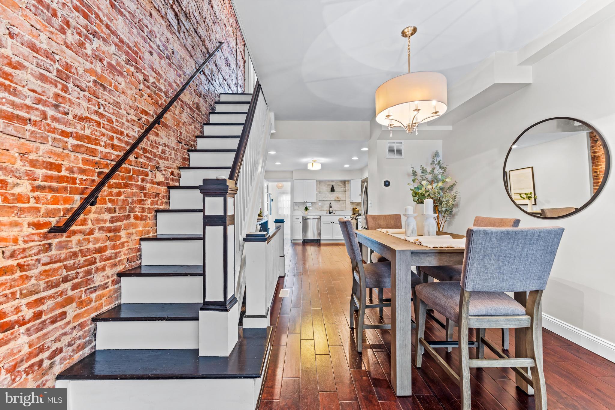 1243 Hull Street Baltimore, MD 21230 - Photo 8 of 39 a view of a dining room with furniture and wooden floor
