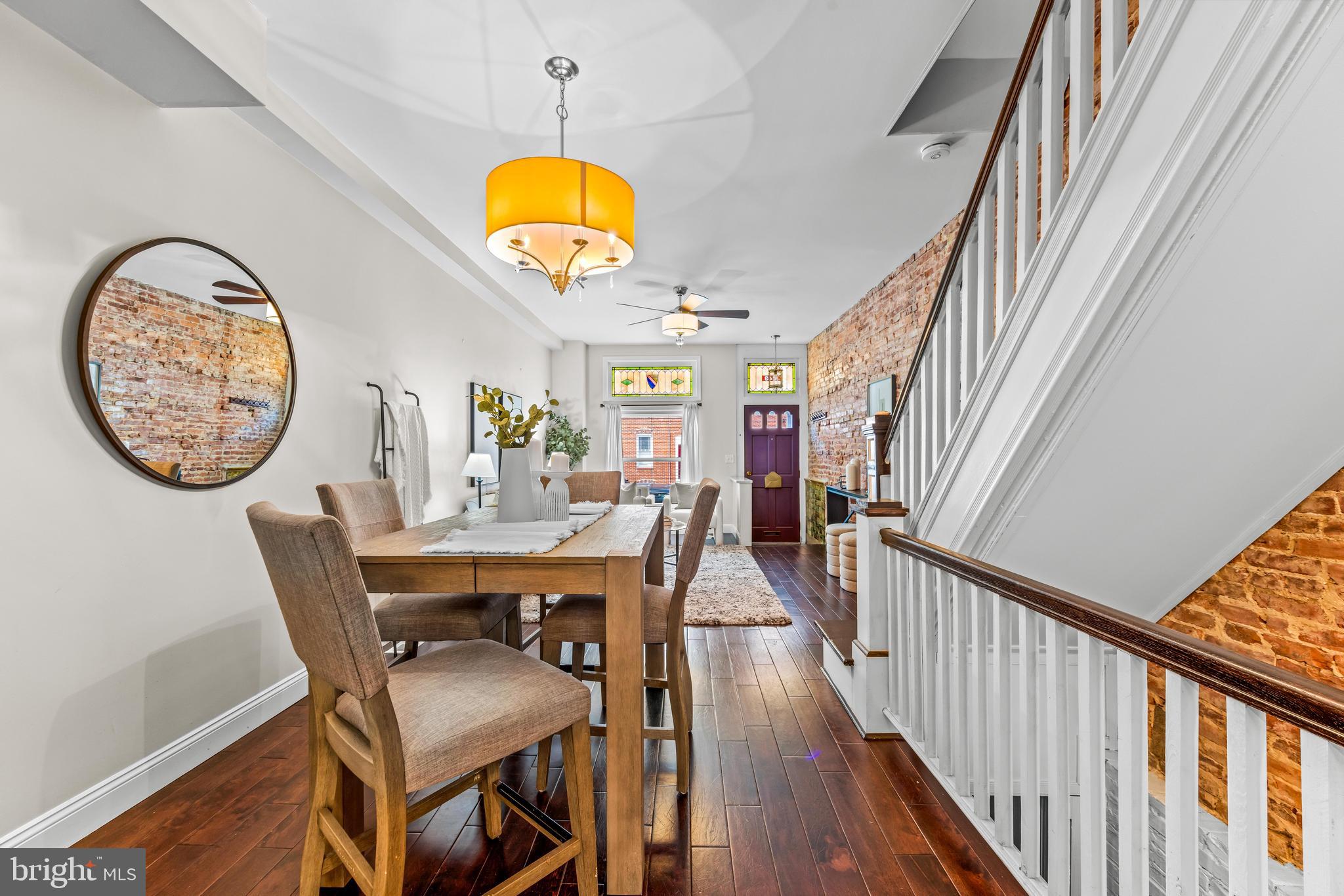 1243 Hull Street Baltimore, MD 21230 - Photo 9 of 39 a view of a dining room with furniture and a chandelier