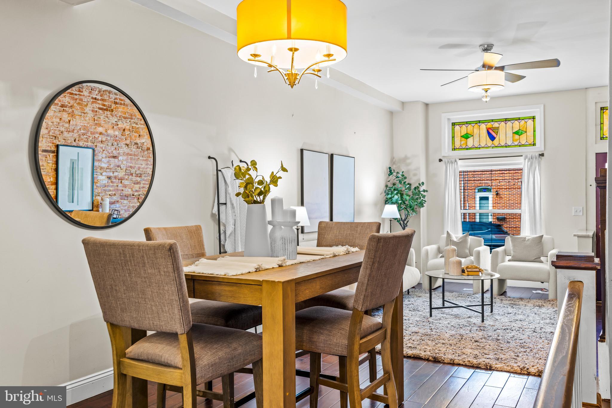 1243 Hull Street Baltimore, MD 21230 - Photo 10 of 39 a dining room with furniture and a chandelier