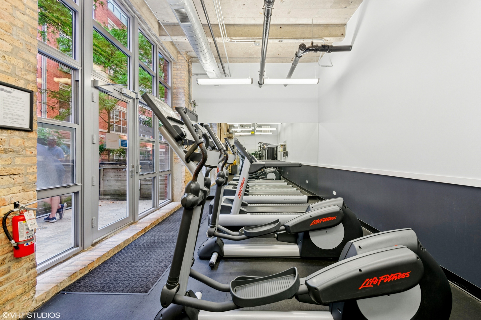 1735 North Paulina Street, Unit 322 Chicago, IL 60622 - Photo 17 of 23 a view of a room with gym equipment