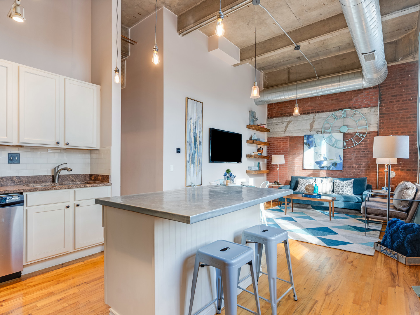 1735 North Paulina Street, Unit 322 Chicago, IL 60622 - Photo 3 of 23 a kitchen with stainless steel appliances granite countertop a sink and cabinets