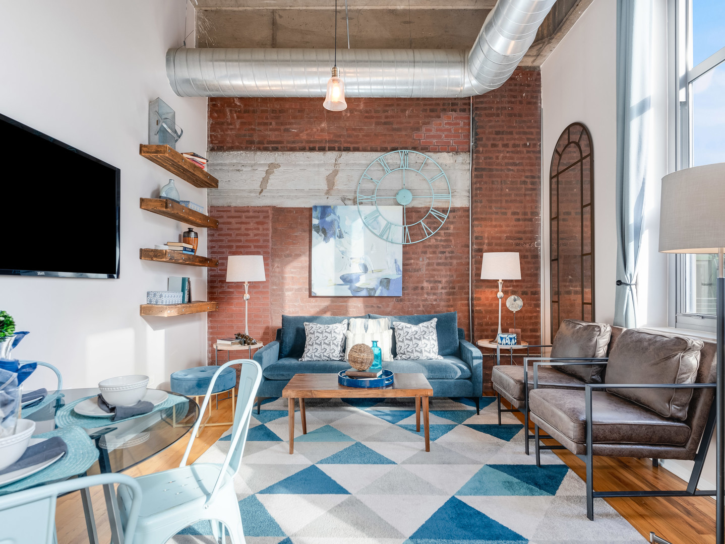 1735 North Paulina Street, Unit 322 Chicago, IL 60622 - Photo 6 of 23 a living room with patio furniture and a flat screen tv