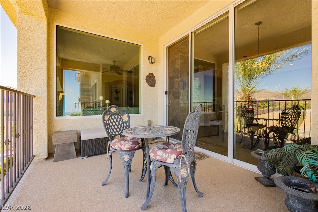2555 Hampton Road, Unit 3308 Henderson, NV 89052 - Photo 25 of 65 Unwind on this peaceful patio, offering seamless indoor-outdoor living and scenic views.