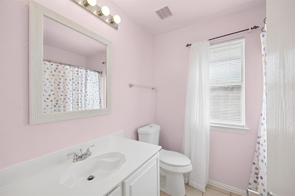 1747 Preston On The Lake Boulevard Little Elm, TX 75068 - Photo 17 of 23 a bathroom with a sink a toilet and shower