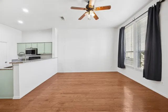 a view of a kitchen with a sink and dishwasher