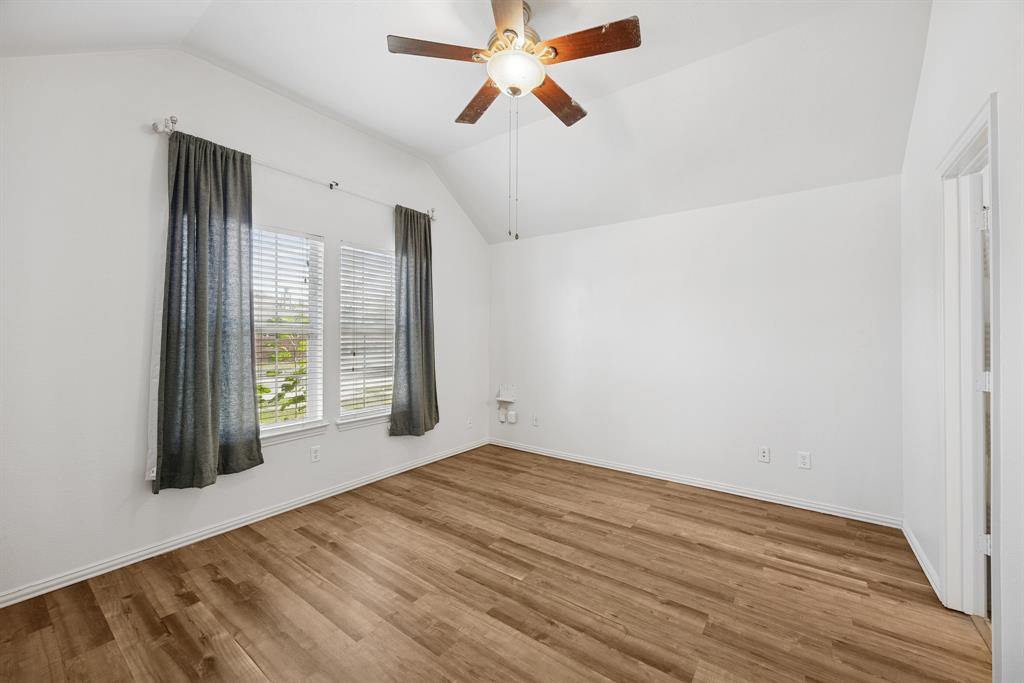 1747 Preston On The Lake Boulevard Little Elm, TX 75068 - Photo 9 of 23 wooden floor in an empty room with a window