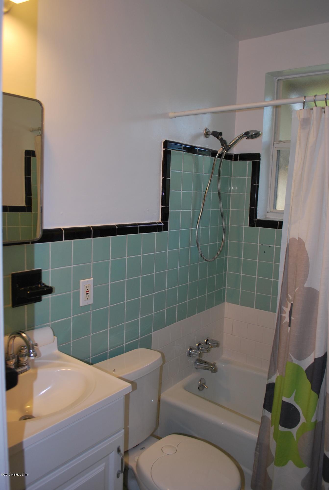 3917 Jean Street Jacksonville, FL 32205 - Photo 13 of 19 a bathroom with a sink and toilet