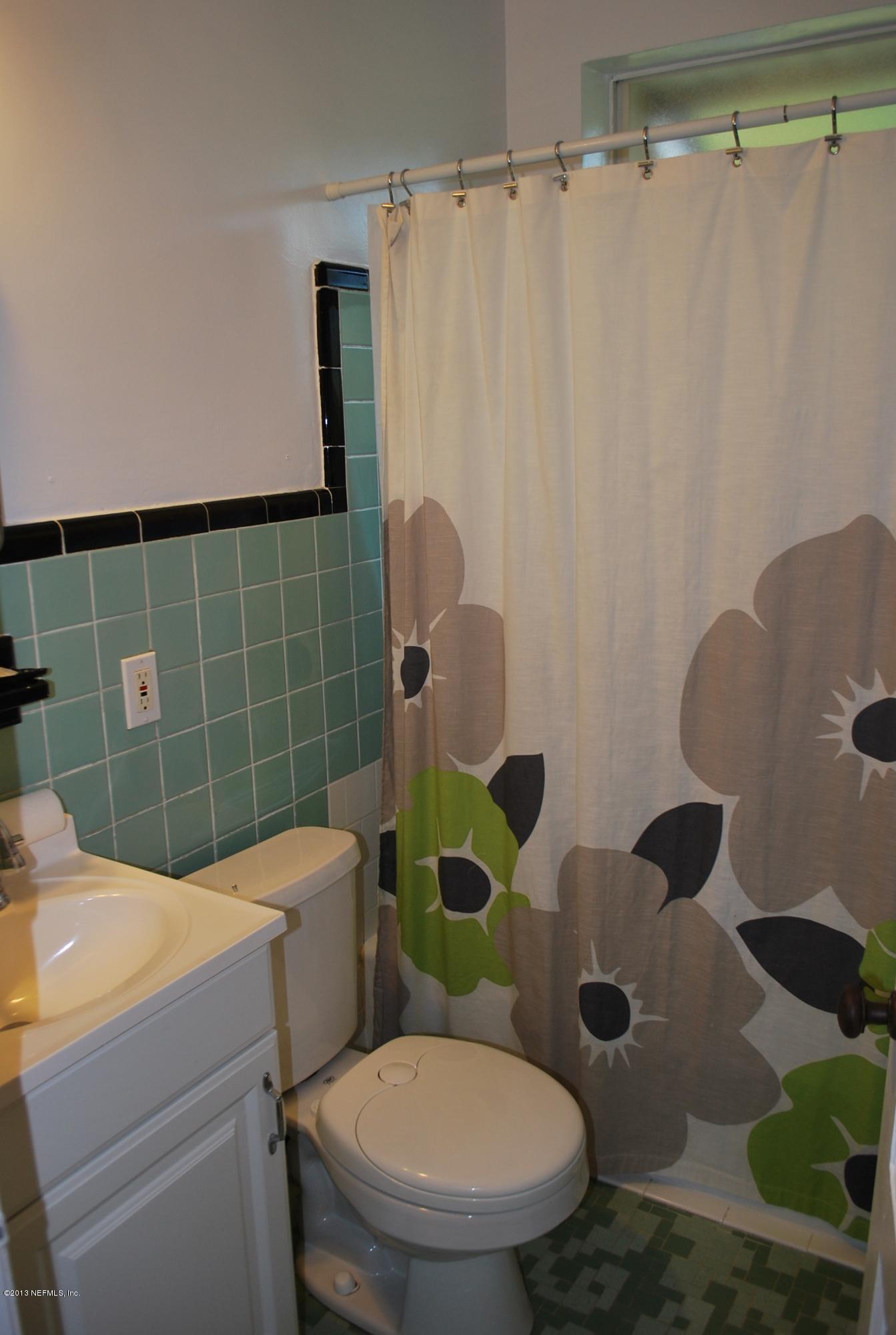 3917 Jean Street Jacksonville, FL 32205 - Photo 14 of 19 a bathroom with a toilet and a shower