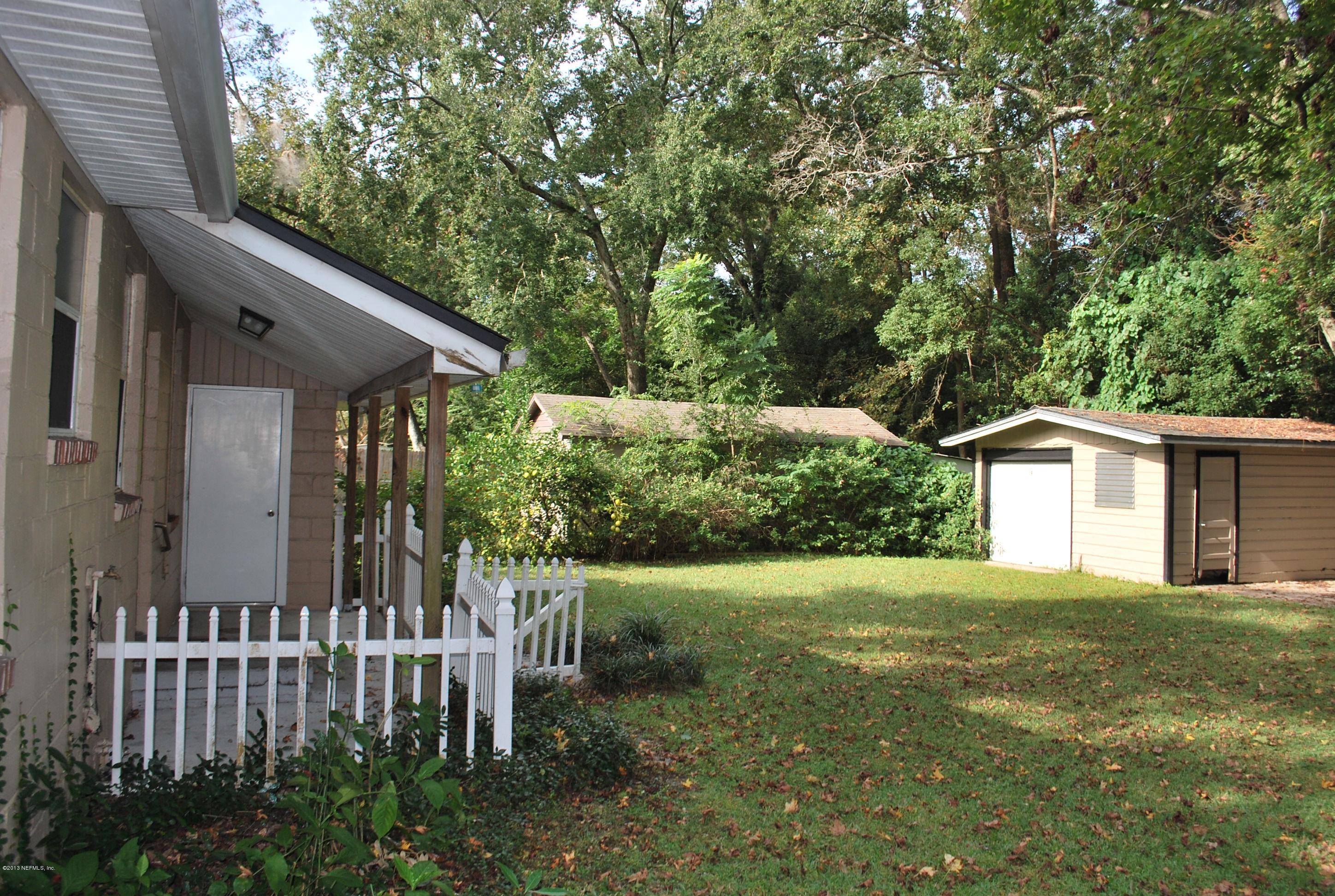 3917 Jean Street Jacksonville, FL 32205 - Photo 17 of 19 a view of a house with a yard and plants
