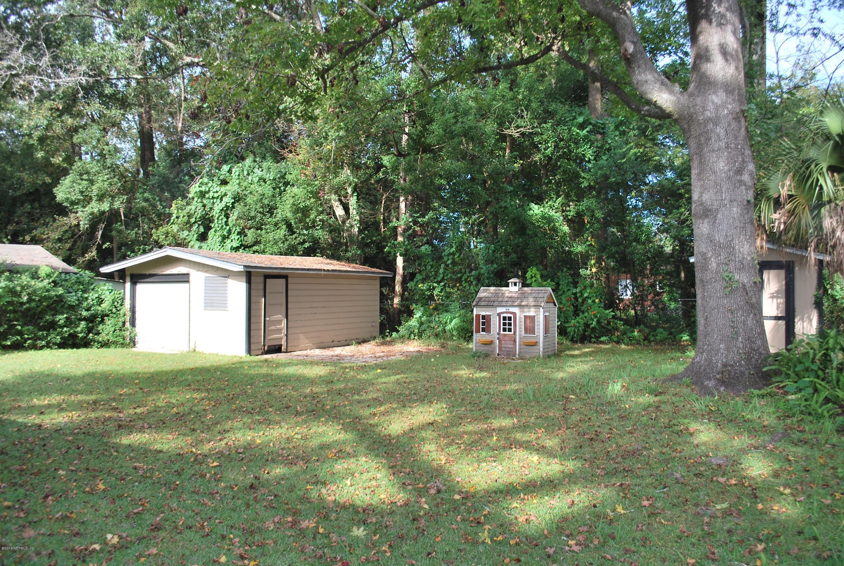 3917 Jean Street Jacksonville, FL 32205 - Photo 18 of 19 a white house that has a tree in front of it