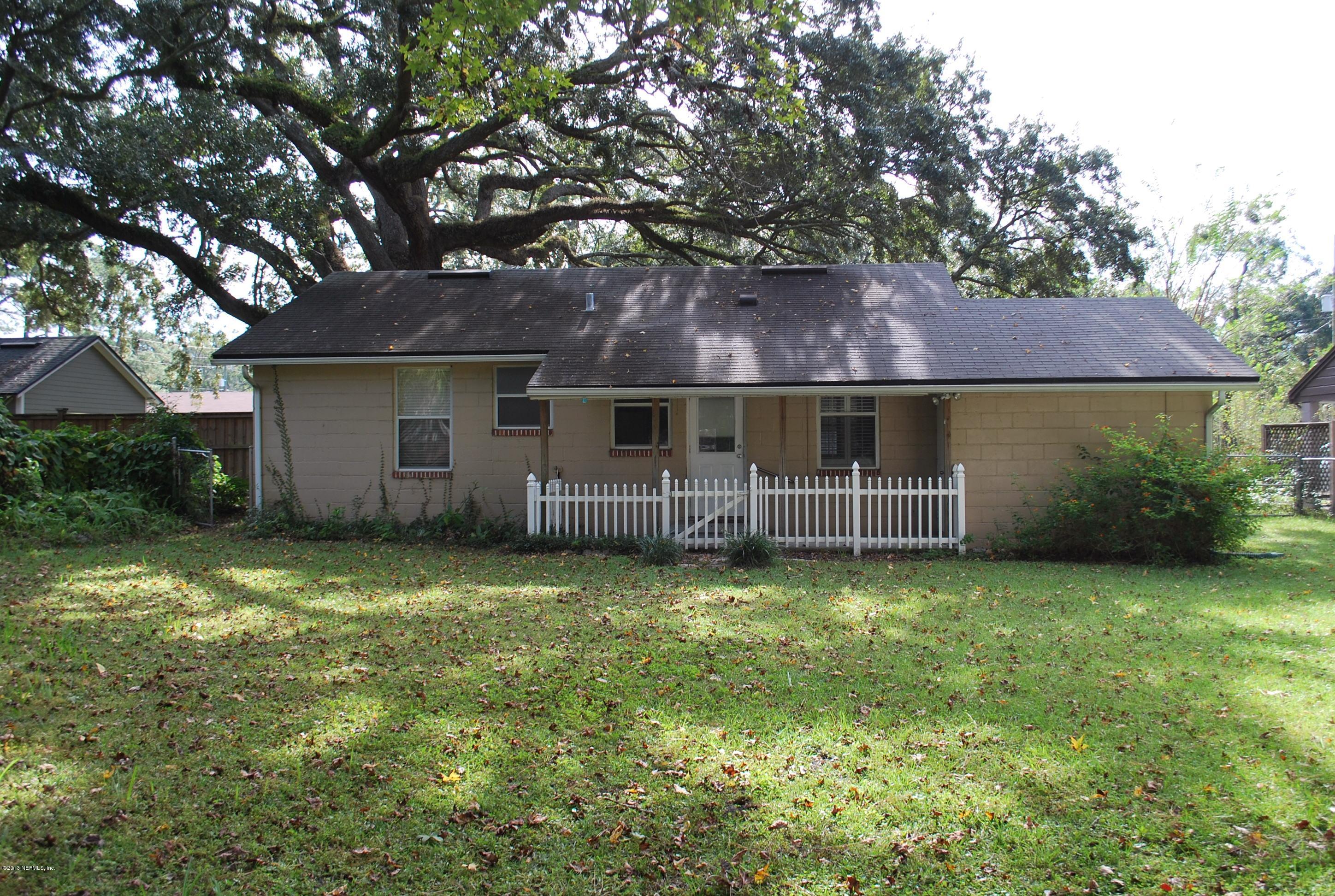 3917 Jean Street Jacksonville, FL 32205 - Photo 19 of 19 a view of a house with a yard and a large tree