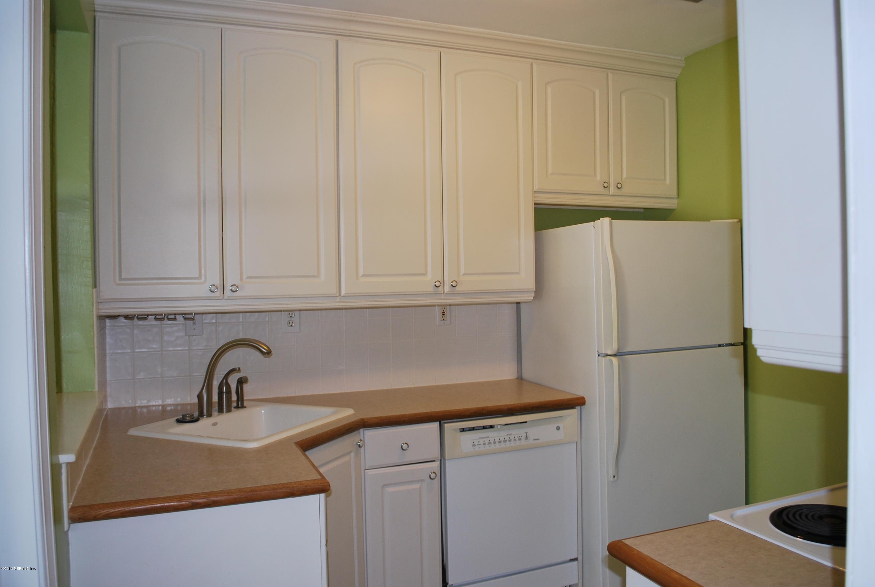 3917 Jean Street Jacksonville, FL 32205 - Photo 7 of 19 a kitchen with refrigerator and cabinets