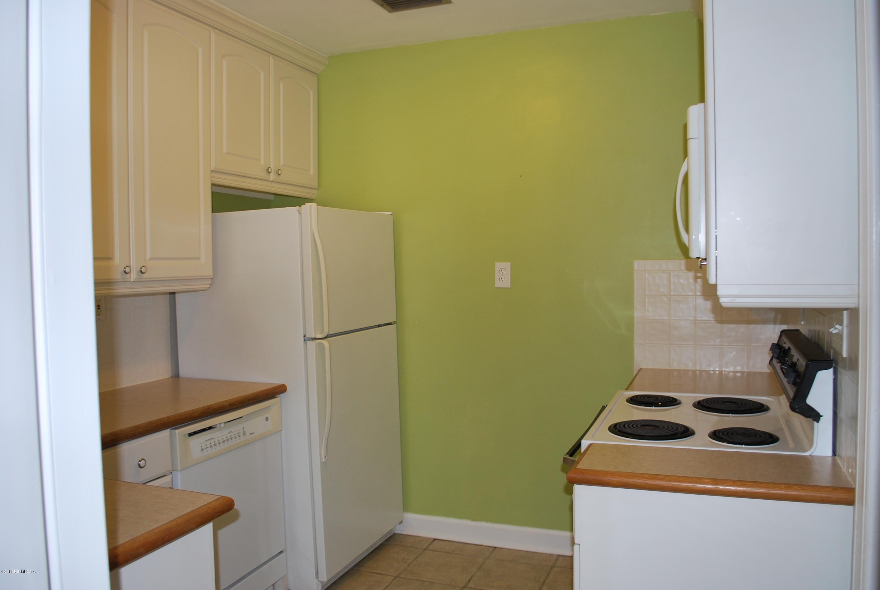 3917 Jean Street Jacksonville, FL 32205 - Photo 8 of 19 a kitchen with a refrigerator sink and stove