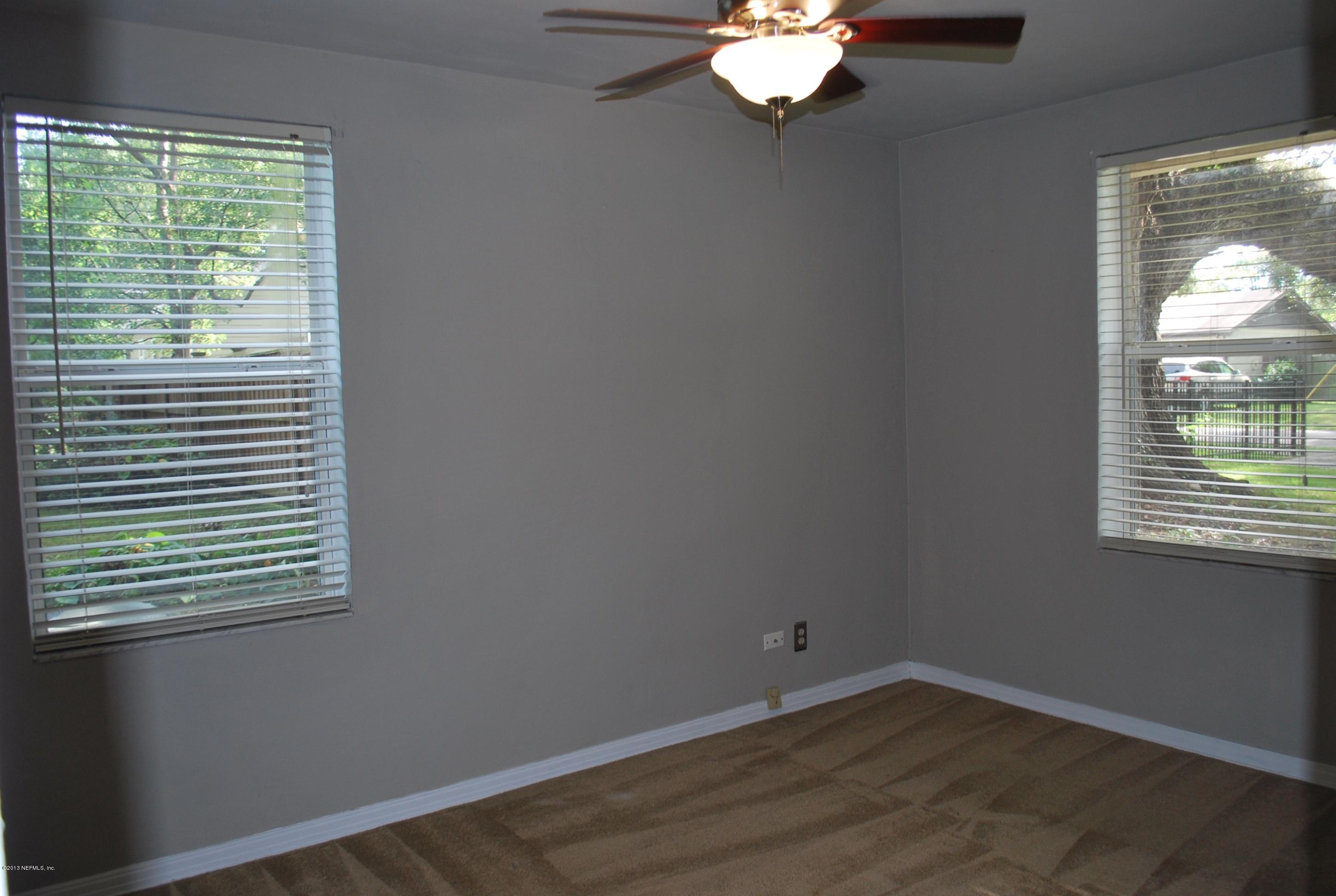 3917 Jean Street Jacksonville, FL 32205 - Photo 10 of 19 a view of a room that has a window in it
