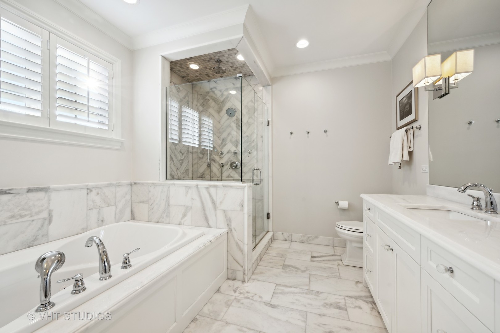 814 17th Street Wilmette, IL 60091 - Photo 24 of 51 a bathroom with a tub a sink and a large mirror