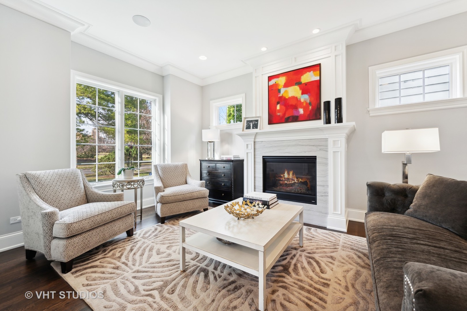 814 17th Street Wilmette, IL 60091 - Photo 4 of 51 a living room with furniture a flat screen tv and a fireplace