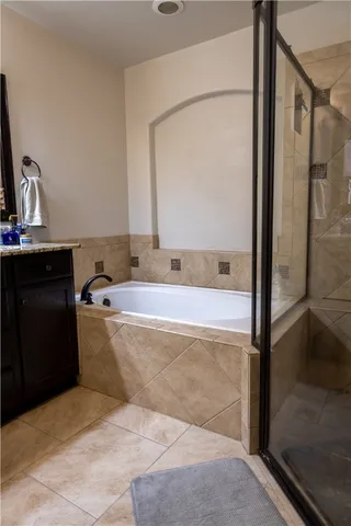 a bathroom with a bathtub and shower
