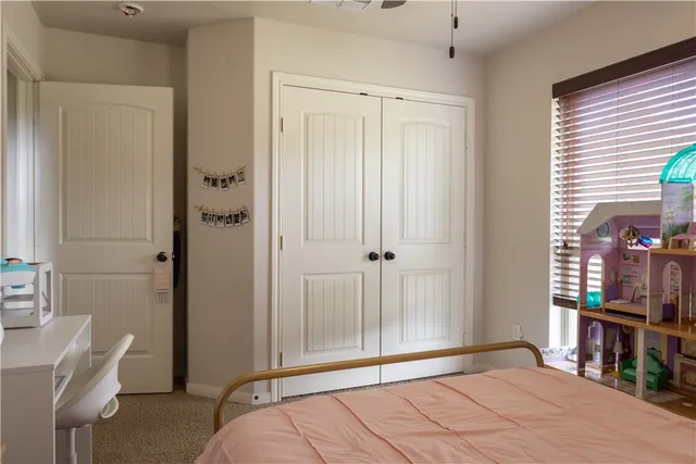 a bedroom with a bed and a tv in it