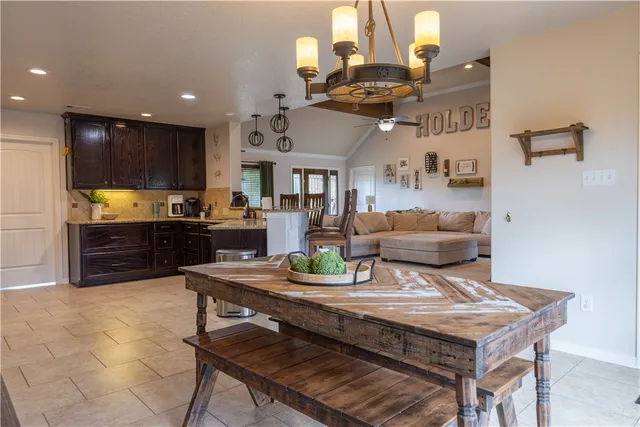 a living room with furniture and kitchen view