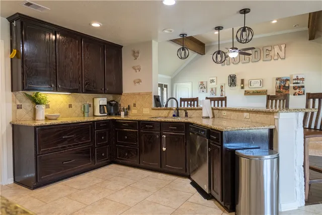 a kitchen with a sink and cabinets