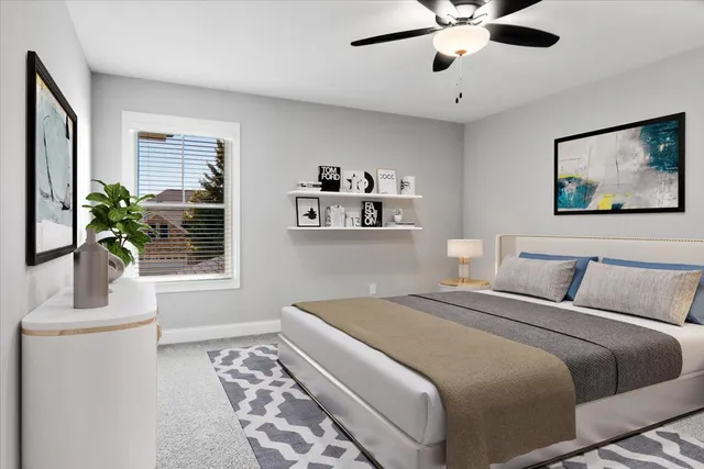 a bedroom with a large bed and a window