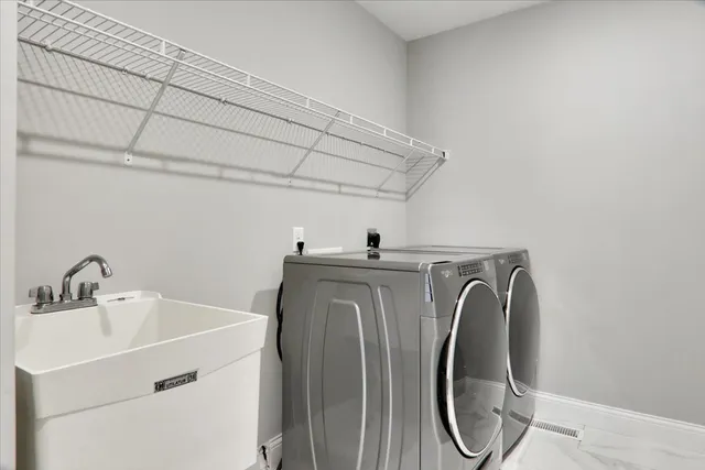 a utility room with dryer and washer