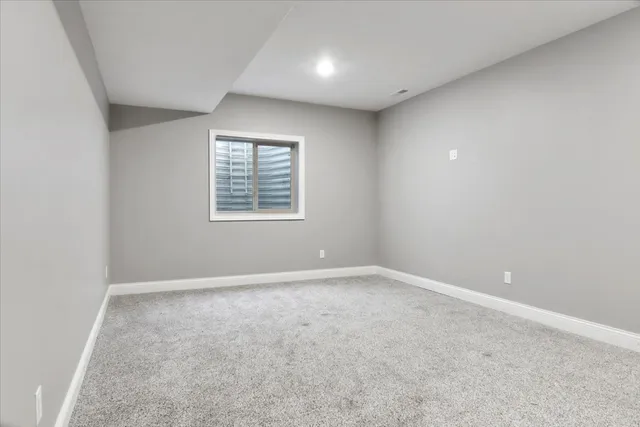 a picture of a bench in front of a gate