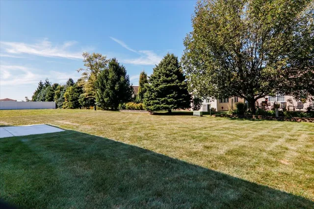 a house that has a big yard in front of it