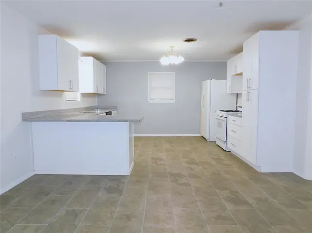 a view of a kitchen with a sink